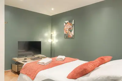 Un ou plusieurs lits dans un hébergement de l'établissement Le Rempart, Appartement Proche Lyon & Villefranche
