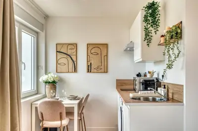 Cuisine ou kitchenette dans l'établissement La Suite Crème - Métro D - Gare de Vénissieux