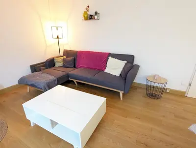 Coin salon dans l'établissement Le Garnier - Lyon 7 avec Balcon & Parking Inclus