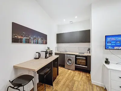 Cuisine ou kitchenette dans l'établissement My Home Saint Jérôme 1
