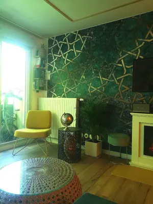 Coin salon dans l'établissement Appartement cosy proche Centre des congrès et Transbordeur