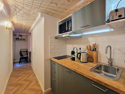Cuisine ou kitchenette dans l'établissement La Suite Brazier