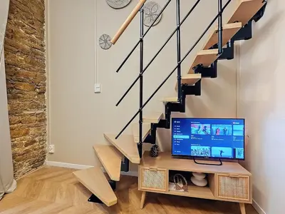 Télévision ou salle de divertissement dans l'établissement La Suite Brazier
