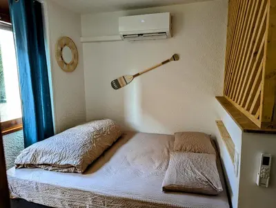 Un ou plusieurs lits dans un hébergement de l'établissement Studio le Lagoon - Bourgoin Centre
