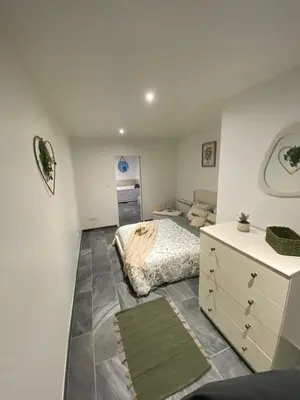 Un ou plusieurs lits dans un hébergement de l'établissement Cosy Home avec Spa - Proximité airport, CNPE, Eurexpo, Groupama Stadium, LYON