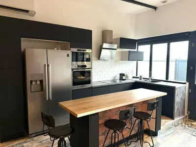 Cuisine ou kitchenette dans l'établissement Le Loft d 'Éveux - 2 places de parking