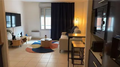 Télévision ou salle de divertissement dans l'établissement Élixir
