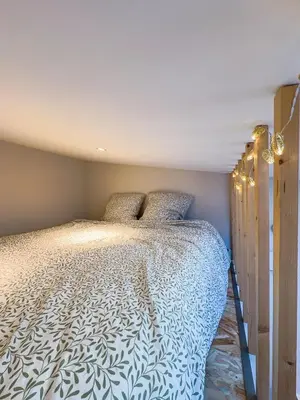 Un ou plusieurs lits dans un hébergement de l'établissement Studio cosy - Petit Parilly