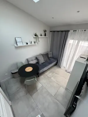 Coin salon dans l'établissement Studio cosy - Petit Parilly