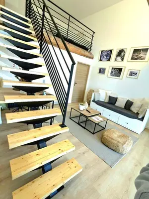 Coin salon dans l'établissement Logement tout confort au calme dans un ancien Fenil
