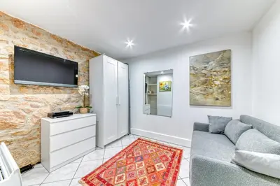 Télévision ou salle de divertissement dans l'établissement GuestReady - Duplex Croix Rousse