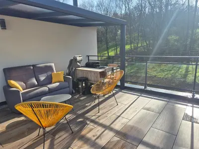 Coin salon dans l'établissement Appartement 1 chambre et terrasse