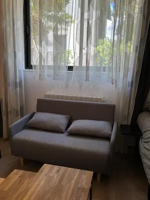 Coin salon dans l'établissement Suite Lyon Coeur Monplaisir