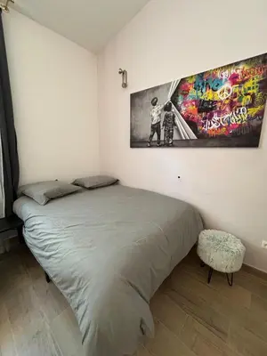 Un ou plusieurs lits dans un hébergement de l'établissement Suite Lyon Coeur Monplaisir