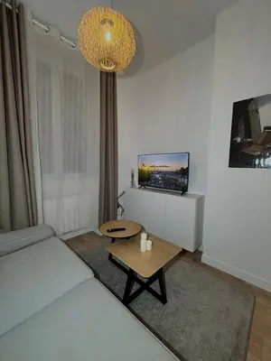 Un ou plusieurs lits dans un hébergement de l'établissement appartement cosy