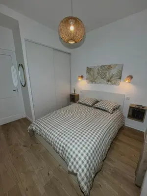 Un ou plusieurs lits dans un hébergement de l'établissement appartement cosy