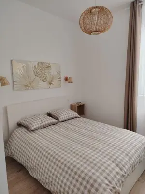 Un ou plusieurs lits dans un hébergement de l'établissement appartement cosy