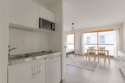 Cuisine ou kitchenette dans l'établissement Cosy avec parking proche Brotteaux