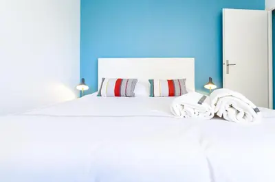 Un ou plusieurs lits dans un hébergement de l'établissement Cosy studio Lyon 1er Croix Rousse