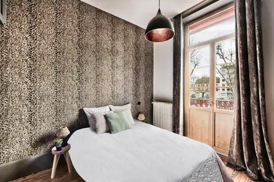 Un ou plusieurs lits dans un hébergement de l'établissement l elegante chambre chez moi