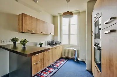 Cuisine ou kitchenette dans l'établissement l elegante chambre chez moi