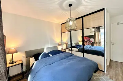Un ou plusieurs lits dans un hébergement de l'établissement Superbe Appartement climatisé