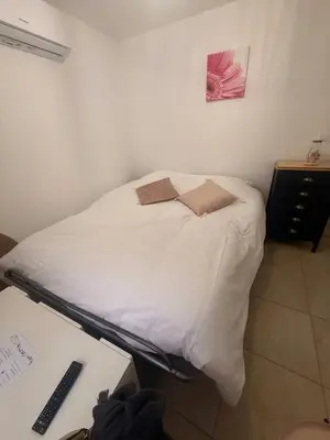 Un ou plusieurs lits dans un hébergement de l'établissement Moulin à Vent Studio Cosy