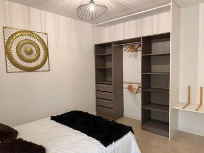 Un ou plusieurs lits dans un hébergement de l'établissement Saint Amour Appartement T2