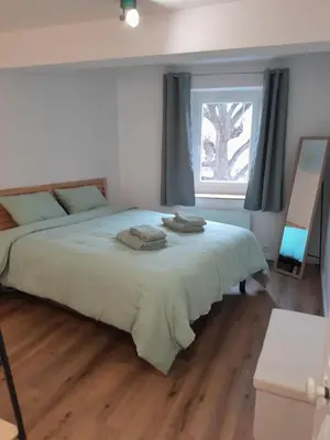 Un ou plusieurs lits dans un hébergement de l'établissement Charmant appartement au cœur de Montrond