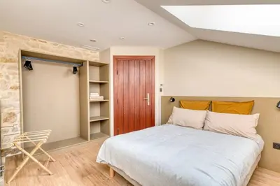 Un ou plusieurs lits dans un hébergement de l'établissement le Clos Doré