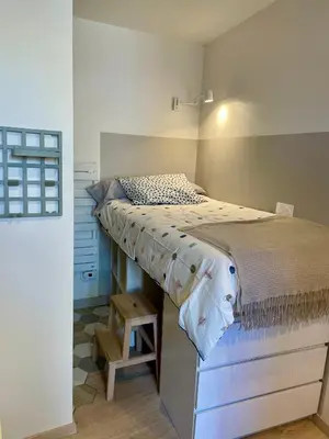 Un ou plusieurs lits dans un hébergement de l'établissement Studio au cœur du village