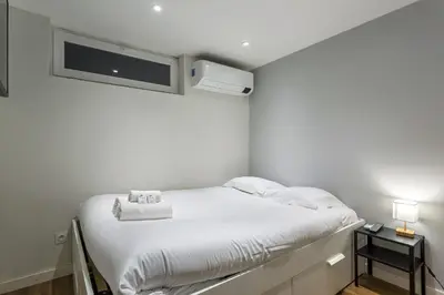 Un ou plusieurs lits dans un hébergement de l'établissement Smartstay Louis Mille - Gratte-Ciel