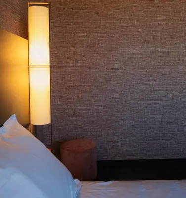Un ou plusieurs lits dans un hébergement de l'établissement Hotel Oceania Lyon