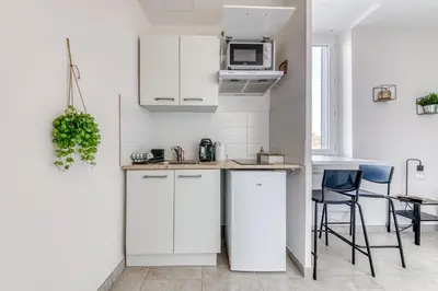 Cuisine ou kitchenette dans l'établissement Studio Le Saphir NEUF & Cosy - Gare Parilly