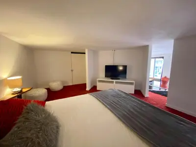 Un ou plusieurs lits dans un hébergement de l'établissement LE LOFT des Charmettes