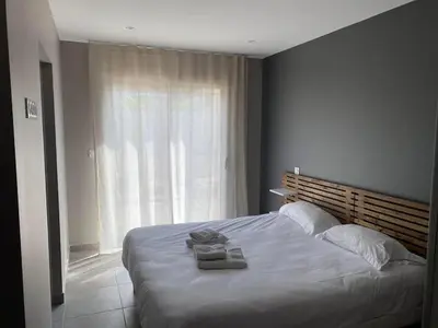 Un ou plusieurs lits dans un hébergement de l'établissement Les Villas Gîtes de Vertrieu