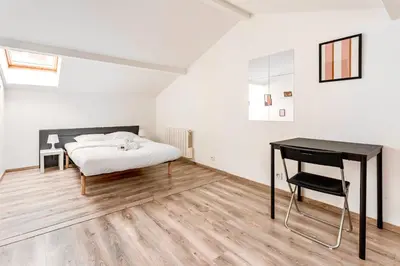 Un ou plusieurs lits dans un hébergement de l'établissement Le Mûrier - Maison de ville avec patio parking - 6 pers