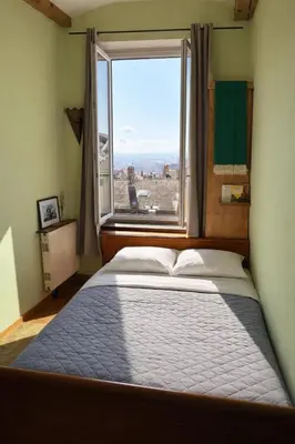 Un ou plusieurs lits dans un hébergement de l'établissement Charming apartment Croix Rousse with a view