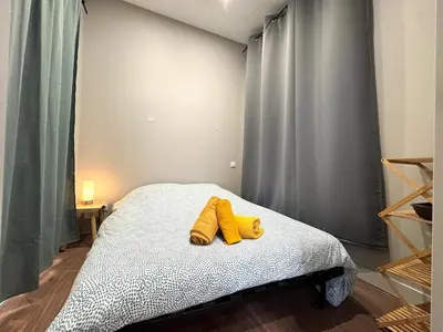 Un ou plusieurs lits dans un hébergement de l'établissement Appartement agréable proche gare