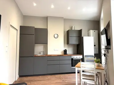 Cuisine ou kitchenette dans l'établissement Appartement agréable proche gare