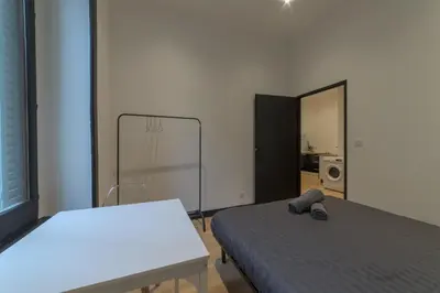 Un ou plusieurs lits dans un hébergement de l'établissement Royal Suite - Villeurbanne centre