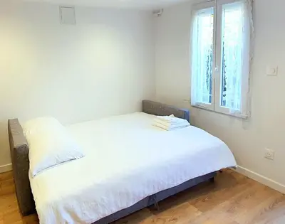 Un ou plusieurs lits dans un hébergement de l'établissement T2 Neuf indépendant-8min de Lyon - Parking privé -Terrasse