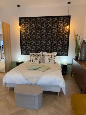 Un ou plusieurs lits dans un hébergement de l'établissement Appartement élégant et chic refait à neuf