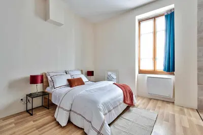 Un ou plusieurs lits dans un hébergement de l'établissement Cozy Confort