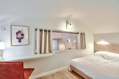 Un ou plusieurs lits dans un hébergement de l'établissement Bel appartement 3 chambres proche Opéra