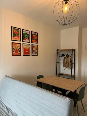Un ou plusieurs lits dans un hébergement de l'établissement Zenith St Étienne Appartement