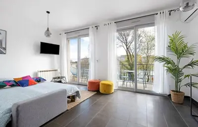 Un ou plusieurs lits dans un hébergement de l'établissement Havre de paix pour 4, clim et balcon, Caluire