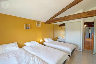 Un ou plusieurs lits dans un hébergement de l'établissement Gite de charme au cœur des Monts du Lyonnais