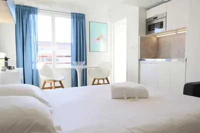 Un ou plusieurs lits dans un hébergement de l'établissement Escapade Urbaine - Studio Lumineux proche gare