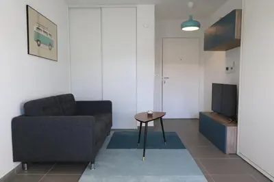 Coin salon dans l'établissement Escapade Urbaine - Studio Lumineux proche gare